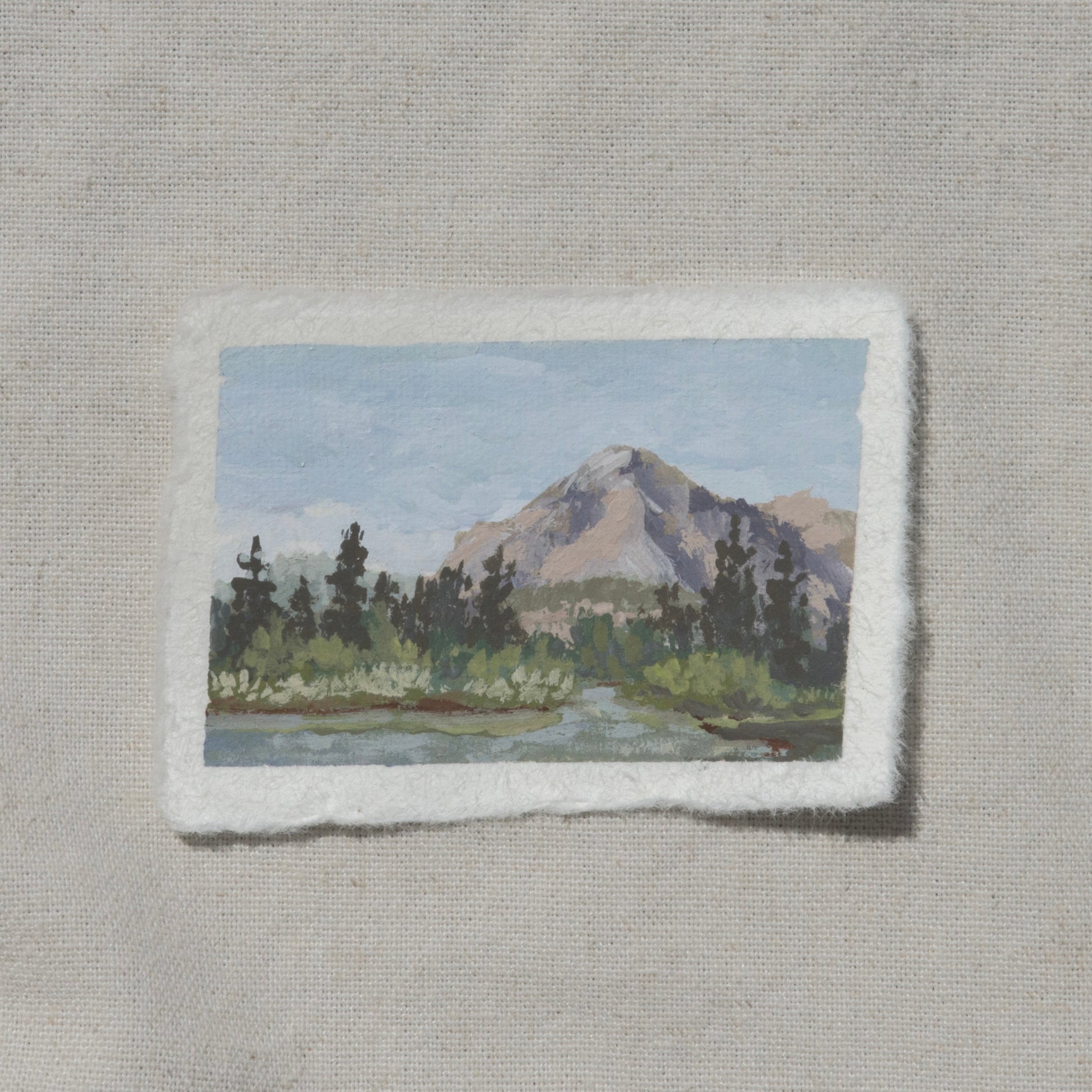 A miniature gouache painting on cotton rag paper with a deckled edge, depicting a landscape with a Kings Canyon mountain and trees from Kings Canyon National Park rae lakes by Laura Van Moorleghem
