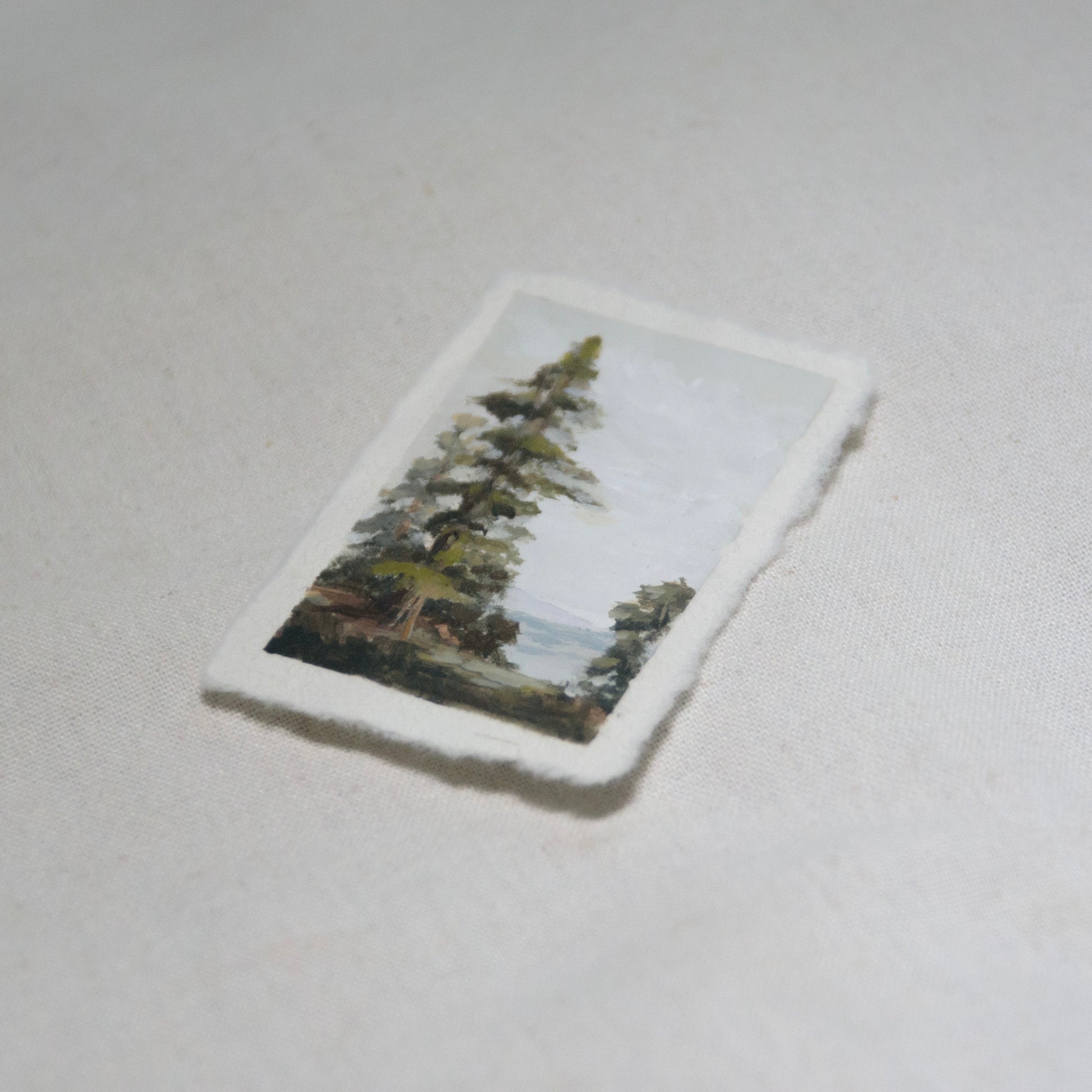 Side profile of redwood oceanscape painting on deckled edge 100% cotton rag paper