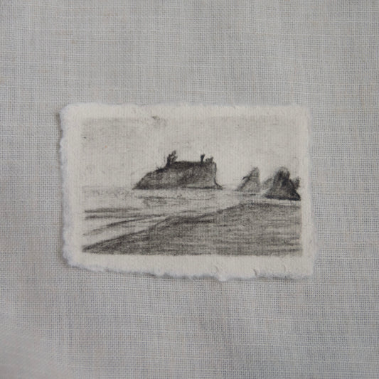 A charcoal sketch of a Ruby Beach scene on deckled edge paper for Olympic National Park by Laura van Moorleghem