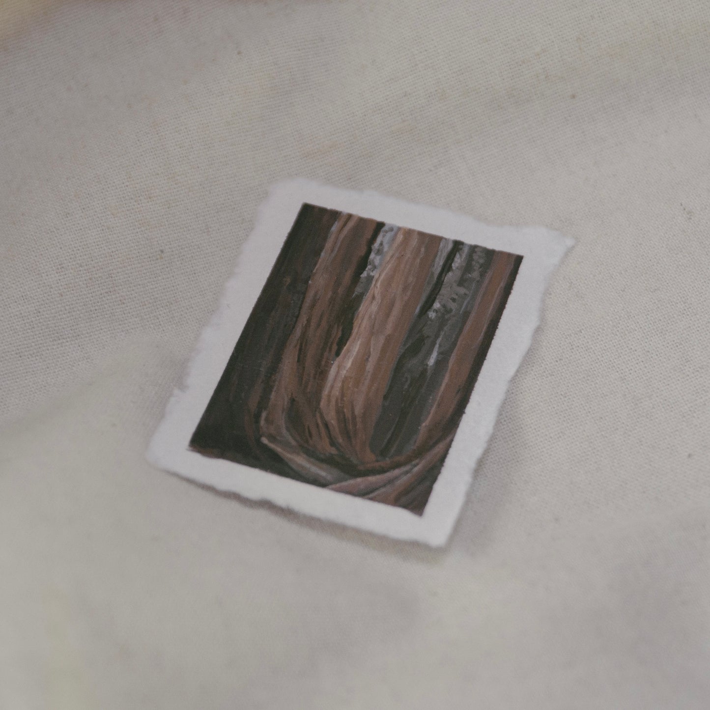 Side profile of a sequoia tree grove in a plein air painting on deckled edge 100% cotton rag paper