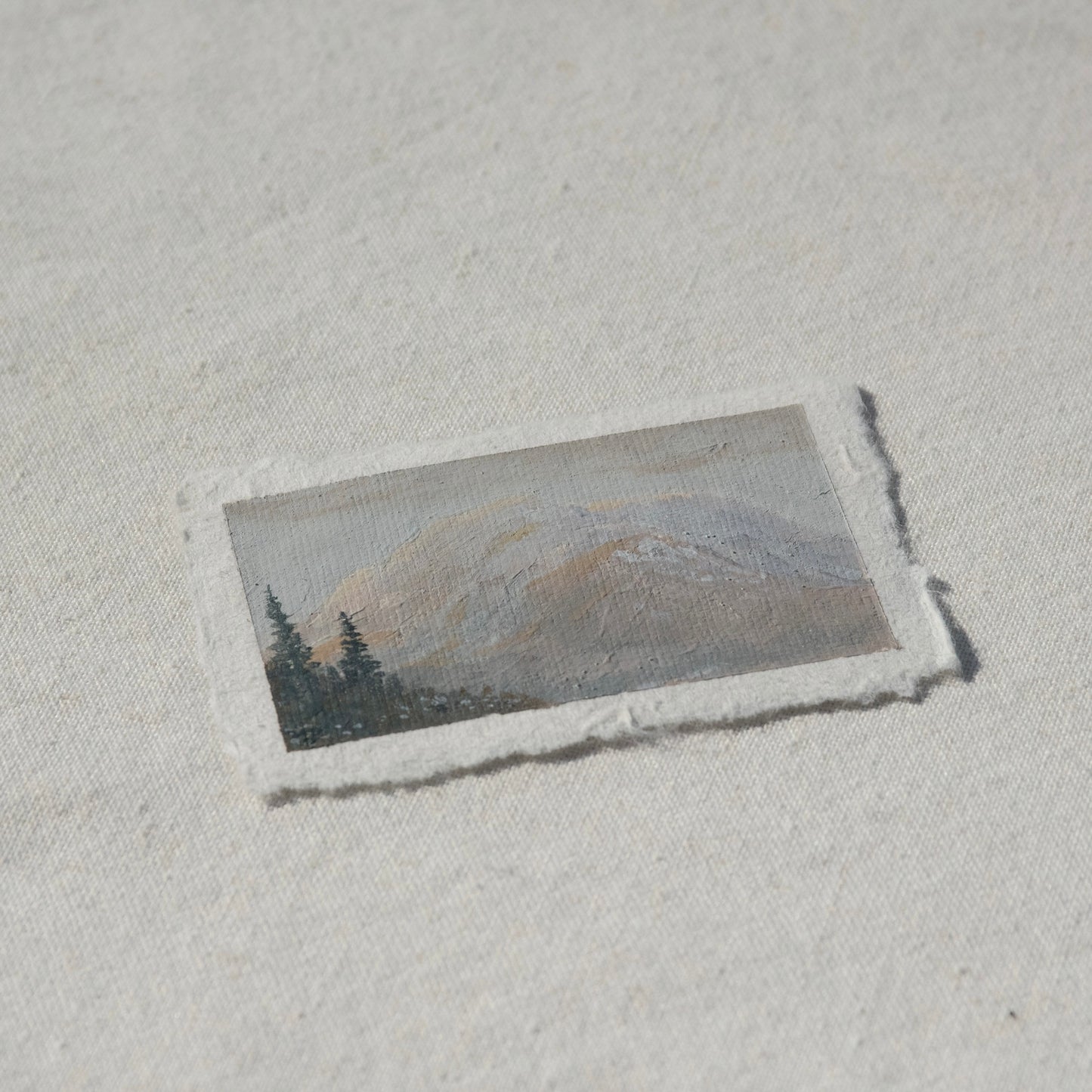 Side profile of mount rainier at sunrise painting on deckled edge 100% cotton rag paper