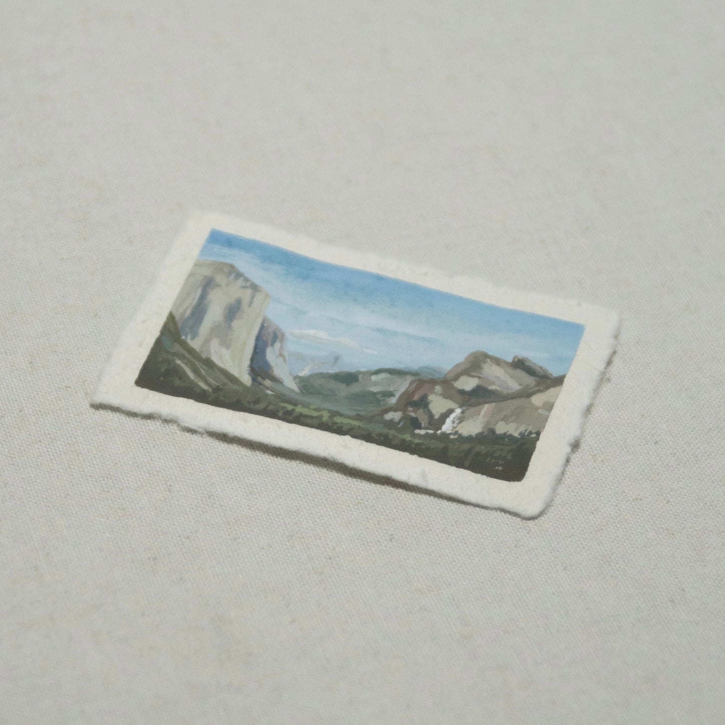 Side profile of Tunnel View Yosemite painting on deckled edge 100% cotton rag paper.