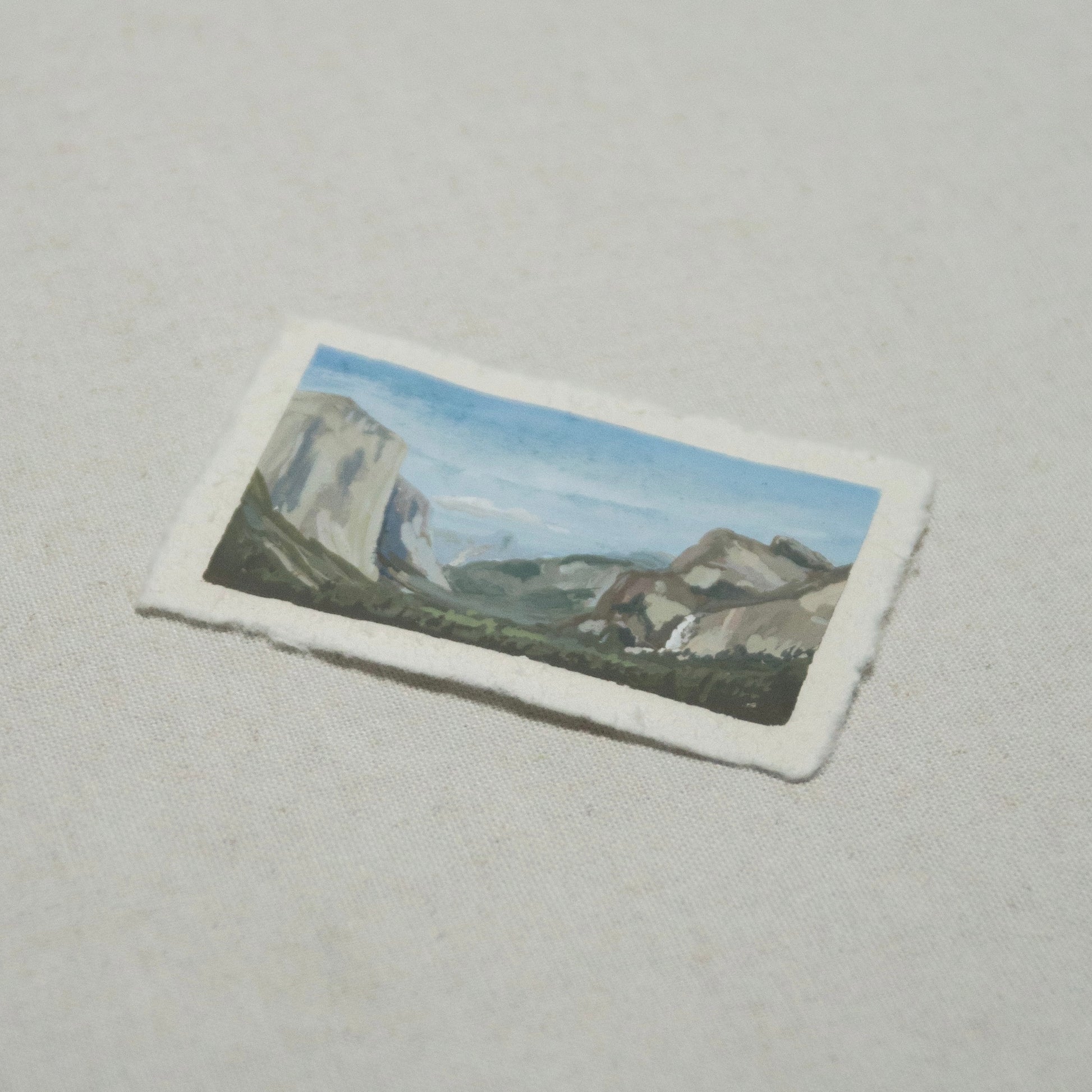 Side profile of Tunnel View Yosemite painting on deckled edge 100% cotton rag paper.