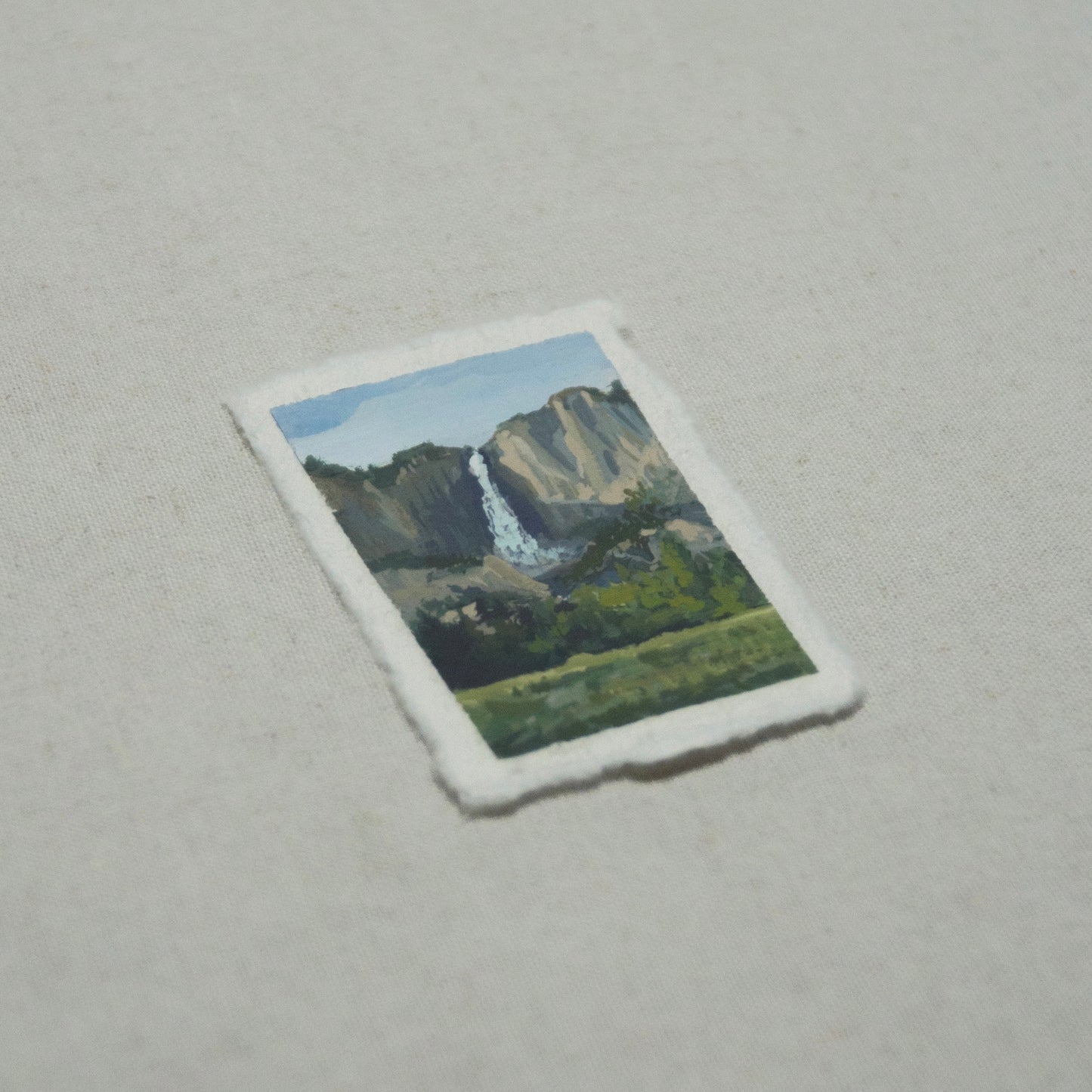 Side profile of Upper Yosemite Falls in Yosemite National Park painting on deckled edge 100% cotton rag paper.